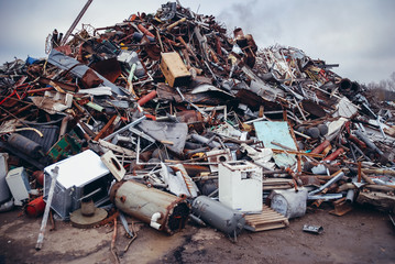 Heap of metal items on a scrap yard in Warsaw, capital city of Poland - obrazy, fototapety, plakaty