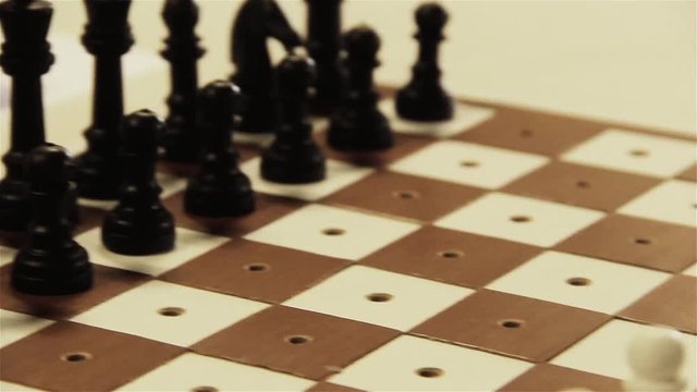 Tactile Chess Game, Chess Set for Visually Impaired (Blind) Players. Each Piece has a Peg that Inserts into the Board, allowing for Tactile Use of the Entire Board while Considering a Chess Move. 