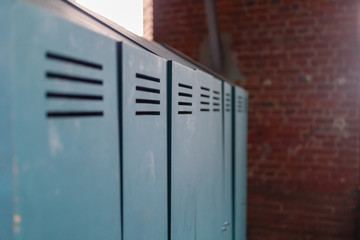 Large green lockers in the sports locker room