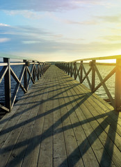Bridge on the water. Walk forward, towards the goal, to the end, to the future, on your path.