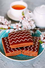 Sweet sunday dessert. Chocolate brownies with black tea.