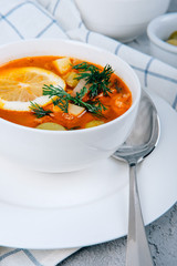 Solyanka a thick soup of vegetables and meat served with lemon and olives