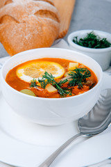 Solyanka a thick soup of vegetables and meat served with lemon and olives