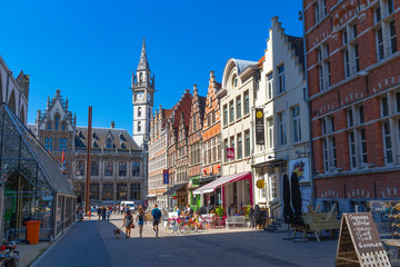 view of the city street with old houses, shops and cafes