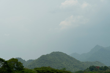 The nature of trees and mountains with thick clouds, the rain will fall.