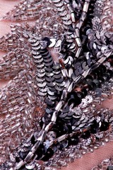 Fabric with sequins and sequins of bright colors. Fashion glitter fabric, sequins. Shiny surface