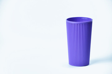 Blue empty plastic cup isolated on white background
