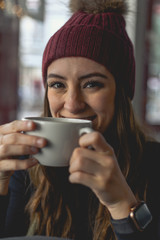 young woman with cup of coffee