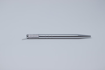 Microblading pen with blades used for applying permanent eyebrow makeup