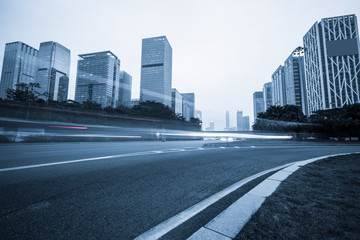 Fototapeta na wymiar urban city road with motion bus at twilight, china.