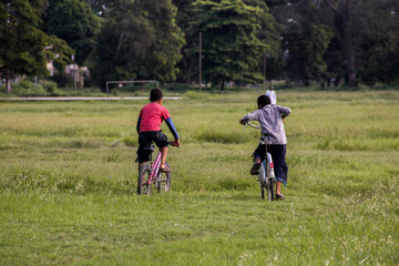 children riding bicycles