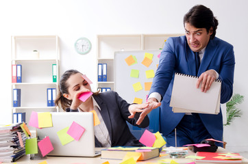 Two colleagues employees working in the office 