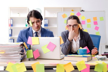 Two colleagues employees working in the office 
