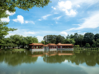 Fototapeta na wymiar Singapore Nov 26, 2018: Traditional Chinese pavilions on the lake at The Chinese Gardens (Lake, bridge, and Twin Pagoda), Singapore.