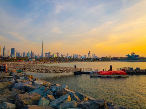 People rest on the beach, La Mer in Dubai