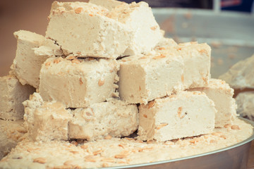Vintage photo, Portion of halva with vanilla and pistachio on stall at bazaar