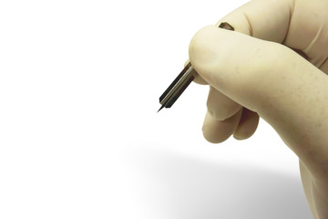 Closeup and croup hand of doctor in white medical glove and shadow holding blood lancet isolate on...