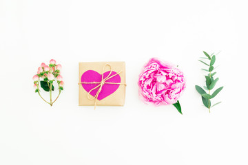 Love composition. Concept with pink peony flower, hypericum and eucalyptus with gift box on white background. Flat lay, top view