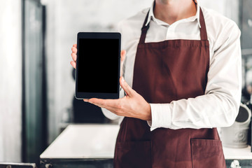 Download Portrait Of Barista Man Small Business Owner Standing With Tablet Computer And Receive Order From Customer In The Cafe Or Coffee Shop In A Cafe Wall Mural Art Photo