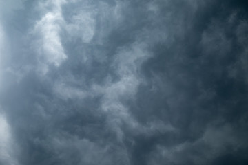 Light in the Dark and Dramatic Storm Clouds background