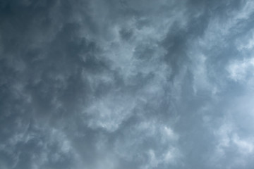 Light in the Dark and Dramatic Storm Clouds background