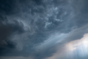 Obraz premium Light in the Dark and Dramatic Storm Clouds background