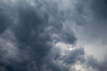 Light in the Dark and Dramatic Storm Clouds background