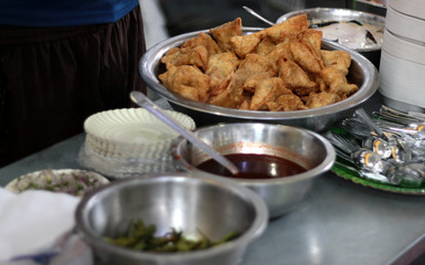 Closeup of Indian street food vendor arrangement in the stall,with samosa, sauce and other ingredients