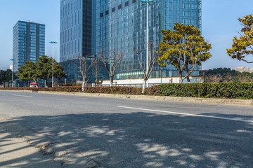 empty asphalt road front of modern buildings.