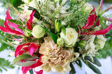 Flower background with gloriosa, carnations and roses.