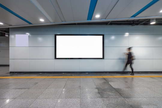 Blank Billboard Banner Light box in Subway station with blurred people Travel