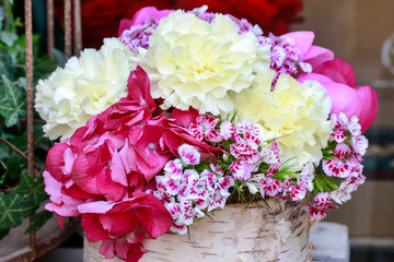 Flower decoration in birch bark vase.
