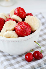 Fruit salad with bananas and strawberries.