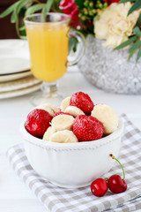 Fruit salad with bananas and strawberries.