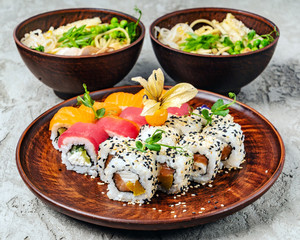 Rainbow Sushi Roll with salmon, eel, tuna, avocado, royal prawn, cream cheese Philadelphia, caviar tobica, chuka. Sushi menu. Japanese food