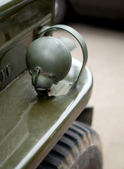 Naklejka na ściany i meble Closeup of a vintage jeep headlight