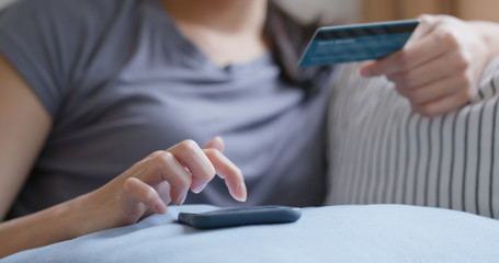 Woman use mobile phone for shopping online with credit card