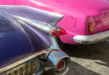 Purple and Pink Classic American Cars in Havana Cuba