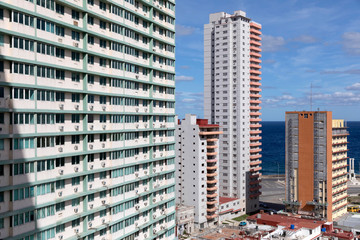 Classic High Rise Buildings in Havana Cuba on sunny day with water views in Vedado built by the...