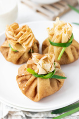 Pancake bags stuffed with with fried oyster mushrooms with spinach