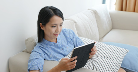 Woman watch on tablet computer