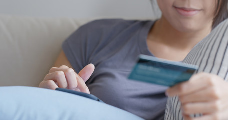 Naklejka premium Woman use mobile phone for shopping online with credit card