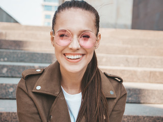Portrait of beautiful smiling brunette model dressed in summer hipster jacket clothes. Trendy girl...