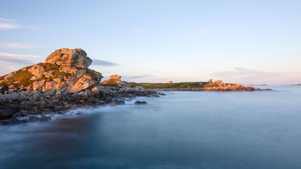 Obraz premium Long exposure of colorful sunrise at the Atlantic ocean, Bretagne, France
