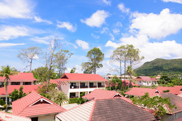 Tropical view over the red roof in a resort of Thailand with a beautiful sunny day.