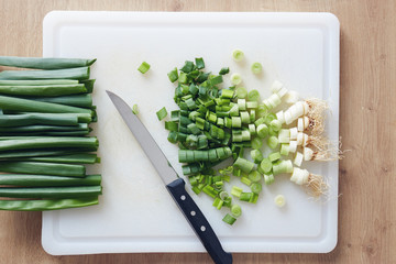 Chopped Spring Onion On Cutting Board.