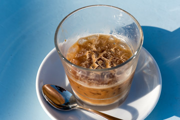 Cold coffee with ice close up