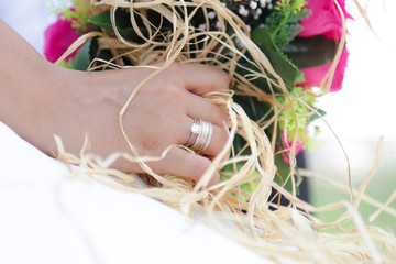 bride holding a purple and white wedding bouquet of flowers. Bride with wedding bouquet 