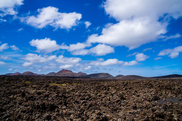 Spain, Lanzarote, Endless solidified lava fields of caldera surrounding colorful volcanoes