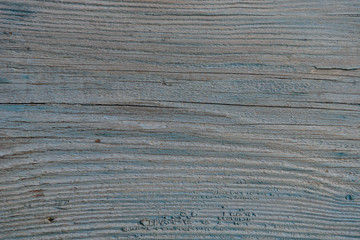 old wooden painted blue board with cracks